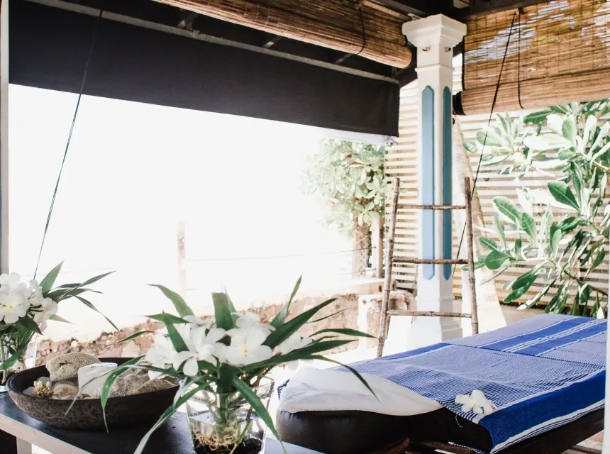 A massage table made up and waiting in the sunlit Wau Wau Massages studio